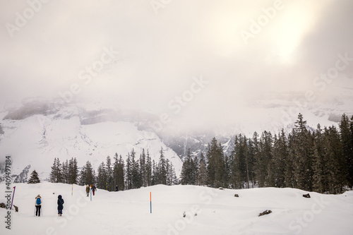 Snowy mountain landscape with people walking
