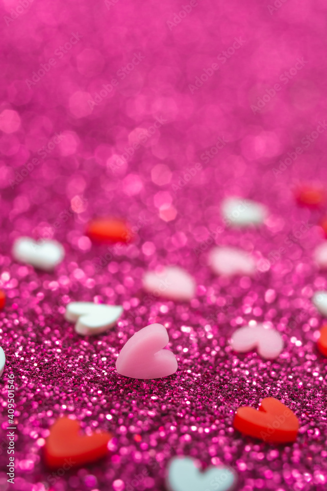 Heart candy confetti, pearl on purple sparkle background. 14 february, valentines day macro concept. Blurred bokeh vertical banner template with copy space. Holiday love card. Selective focus