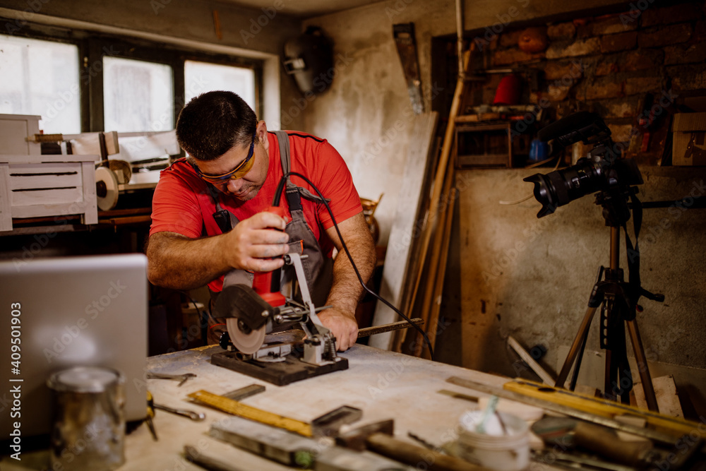 Craftsman cutting metal and using angle grinder