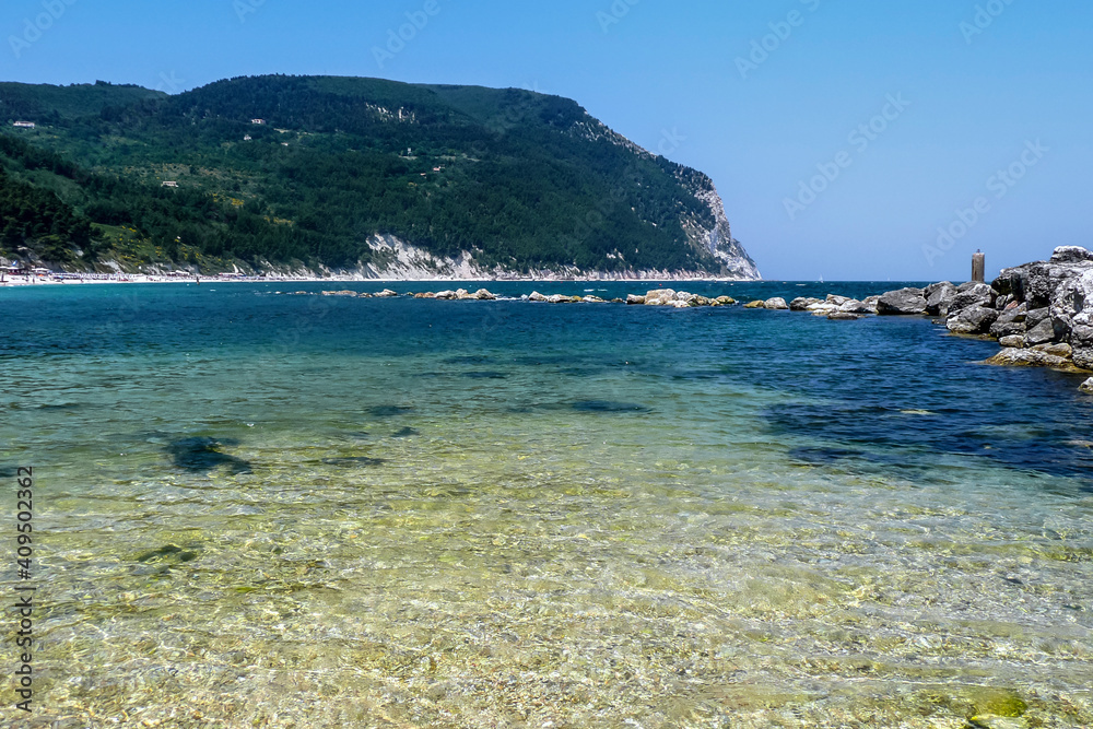 Fototapeta premium The beautiful Urbani Beach in Sirolo, with green water