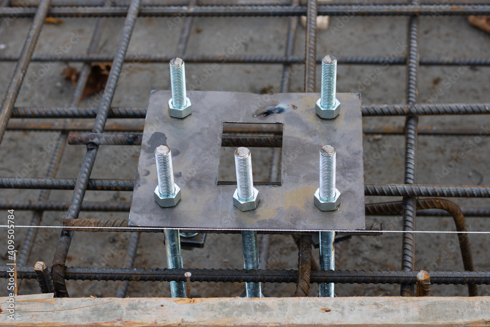 Light pole base and anchor bolts in concrete base. Concrete base