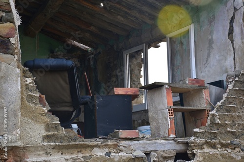 Ruined house with fallen wall. Interior view of a rural office. Village of San Vicente de Munilla. photo