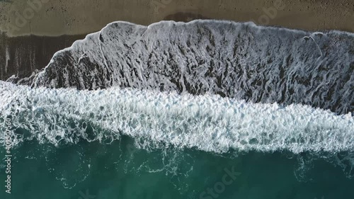 4k video of the sea waves crashing on the beach made by the DJI mini2 drone on the Ligurian coast of Spotorno photo