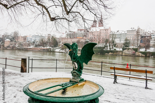 Basel, Basiliskbrunnen, Basilisk, Brunnen, Rhein, Rheinufer, Kleinbasel, Altstadt, Stadt, Winter, Schnee, Schneedecke, Basel-Stadt, Grossbasel, Münster, Schweiz photo