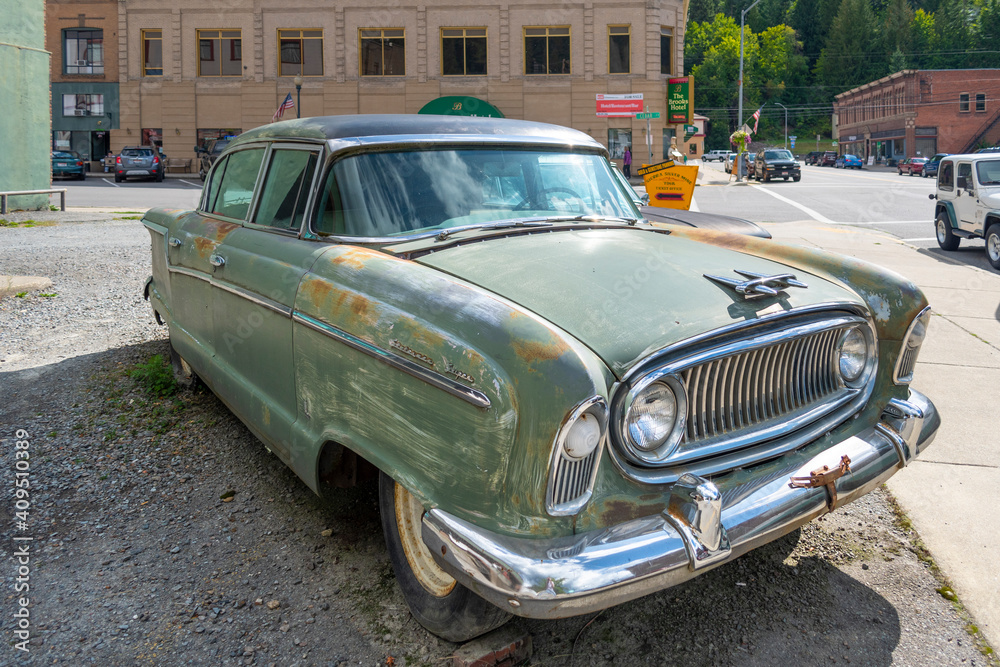 A 1956 vintage Nash Ambassador sits in a parking lot in the historic city of Wallace, Idaho, USA