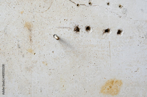 Drilled Holes in White Scratched Concrete Wall Room reconstruction Process