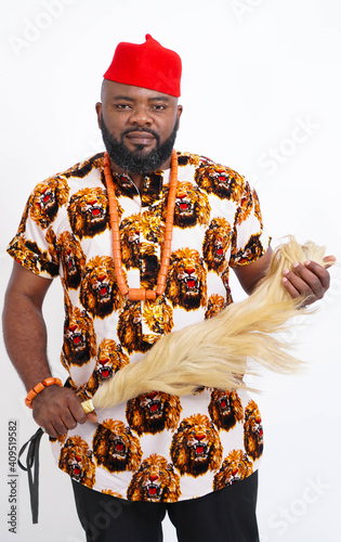 Portrait of Nigerian Igbo man dressed in traditional attire  photo