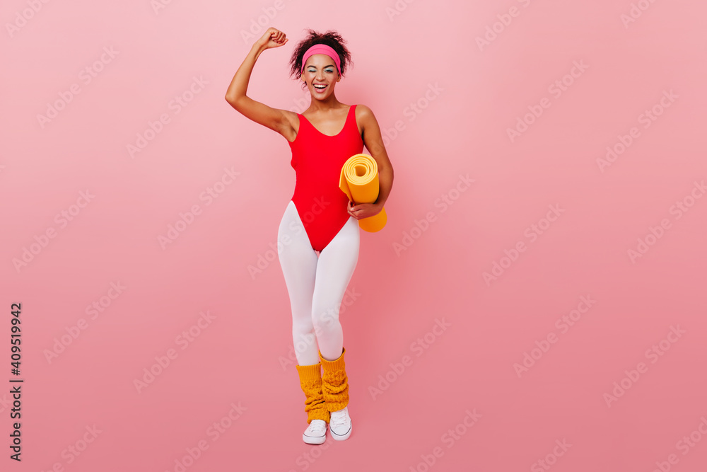 full-length-view-of-strong-african-woman-in-aerobics-form-laughing