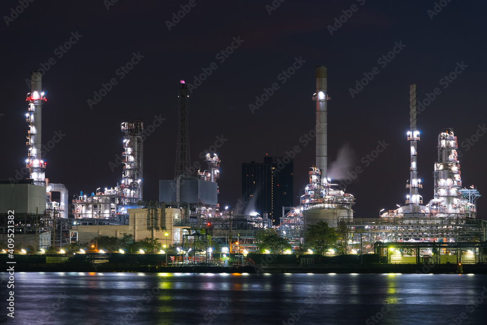 Close up oil and gas industrial, Refinery factory oil storage tank and pipeline steel at night