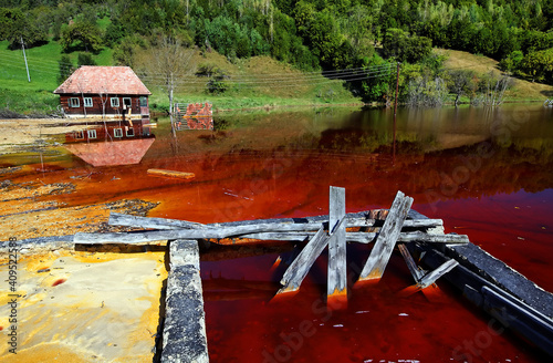 Valea Sessi in the Occidental Carpathians. Nature pollution of a copper mine exploitation photo