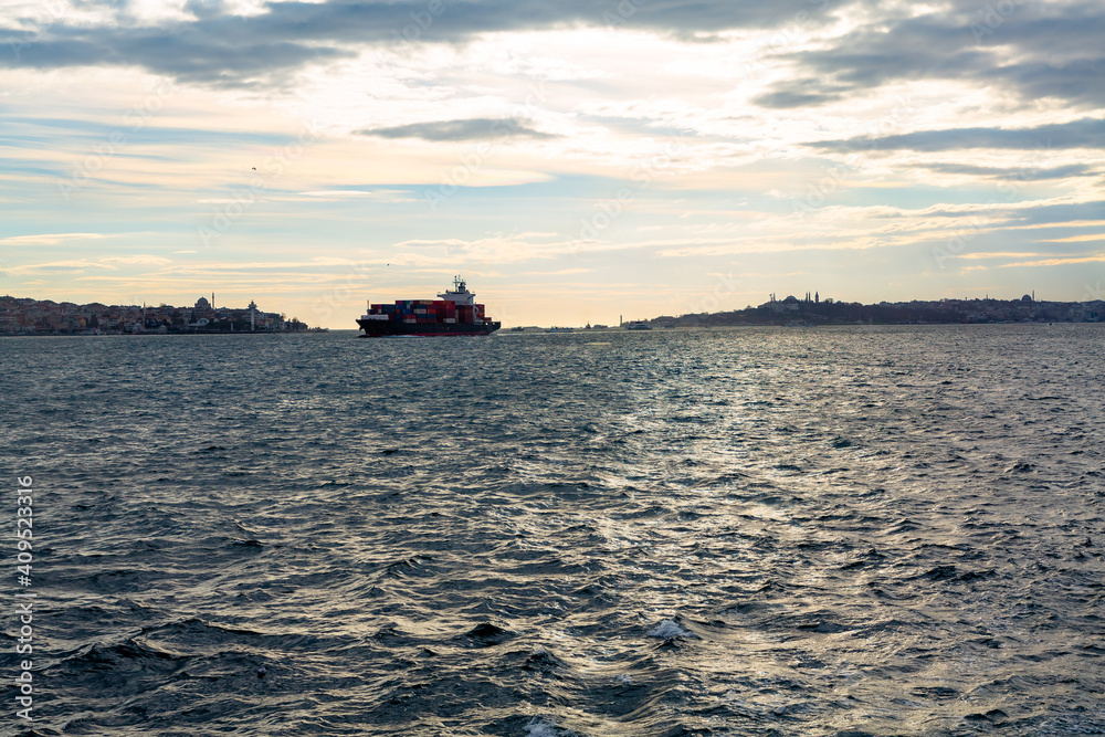 A cargo ship passes through the Bosphorus Strait in Turkey
