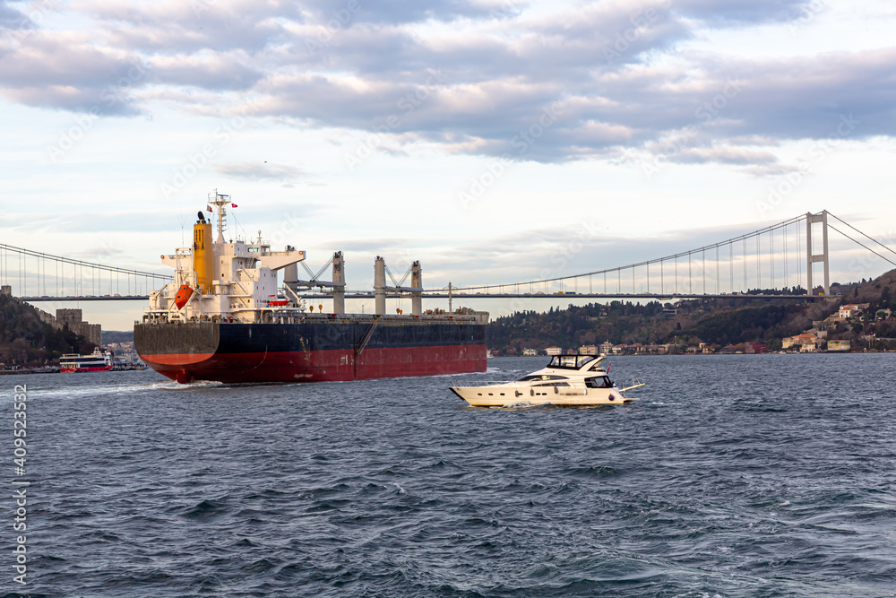 A cargo ship passes through the Bosphorus Strait in Turkey