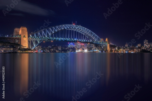 Night scene cityscape of Sydney skyline with illuninated building and bridge at Sydney, Australia