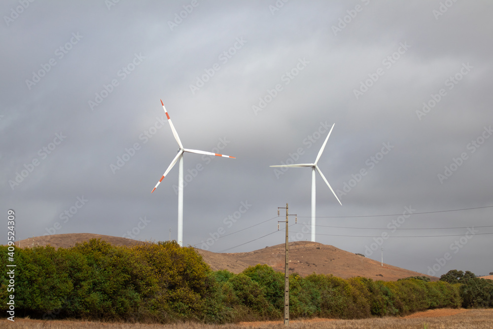 Couple windmills in a rural field in Alentejo. Couple windmills in a rural field in Alentejo.