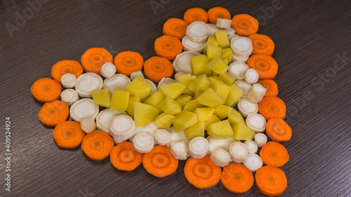 heart shaped vegetables on wooden background / valentines day photo