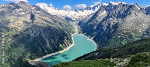 A hike to the Olperer hut with views of Alpine lake Schlegeis in the Zillertal Alps in Austria