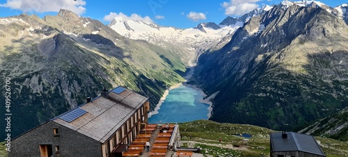 The Olperer hut with views of Alpine lake Schlegeis in the valley Zillertal, Austrian Alps