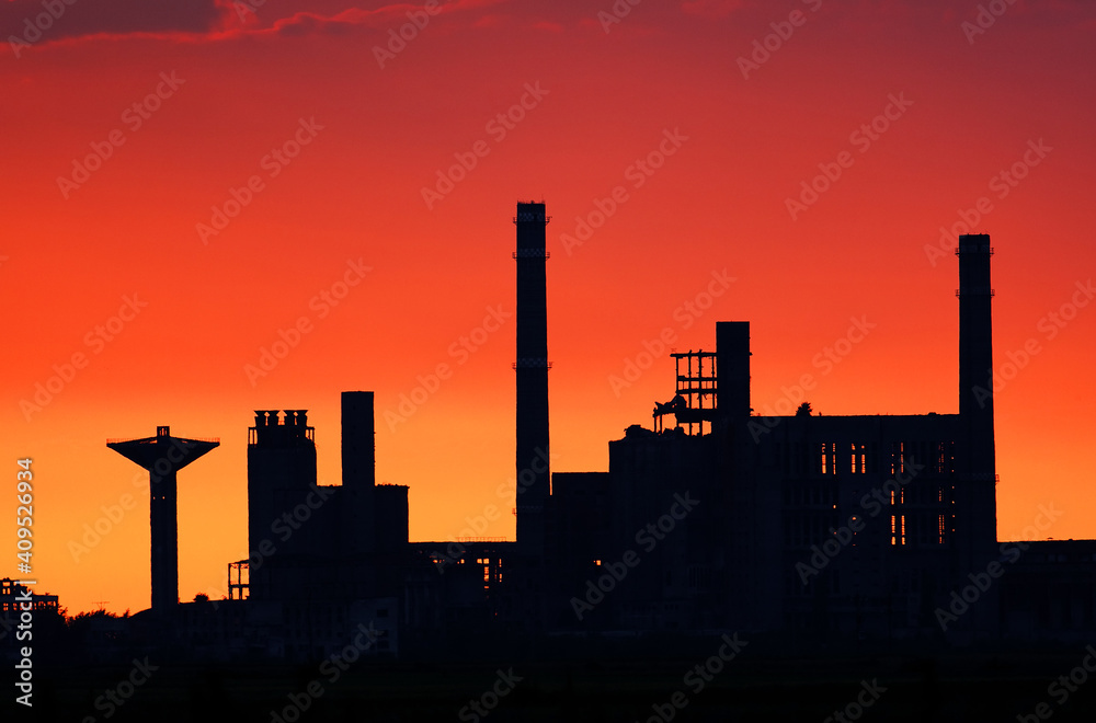Image of a factory silhouette in sunset light