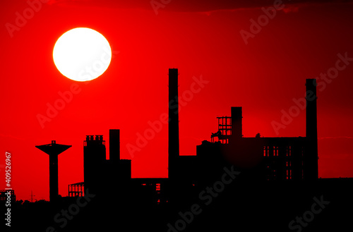 Image of a factory silhouette in sunset light