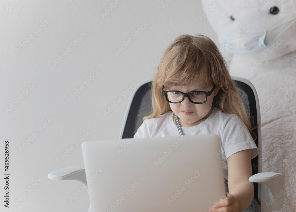 Girl of 5 years old is working at laptop Girl of 5 years old is working at laptop