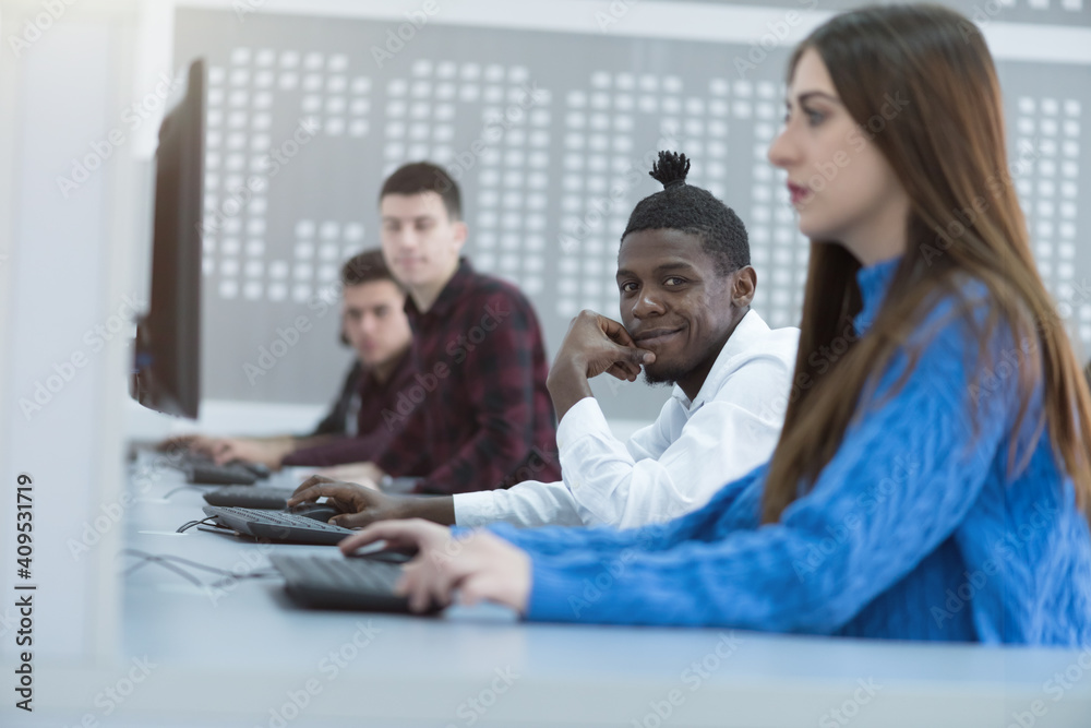 IT workshop at university. Group of Students on class with computer