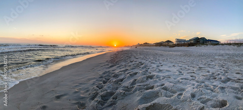 Sunset on the white sands of Navarre Beach, FL