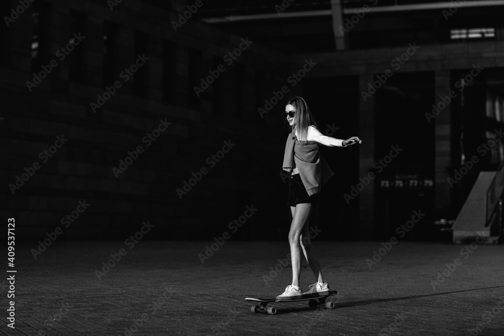 custom made wallpaper toronto digitalContrasting black and white portrait of a woman with a skate in his hands.