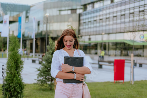 Woman with file folder in hands
