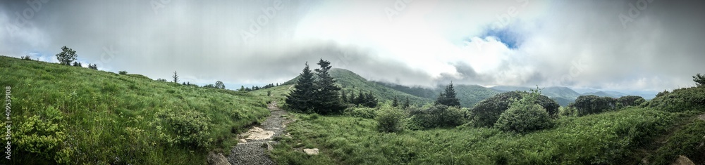 Clouds and broken blue sky over the Balds in Roan Mountain. Tennessee, North Carolina.