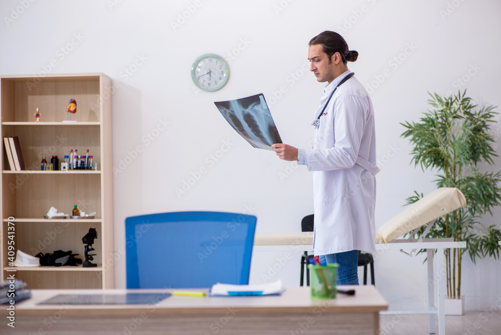 Young male doctor radiologist working in the clinic Young male doctor radiologist working in the clinic