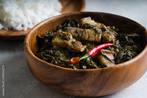 Laing is a Filipino dish of shredded or whole taro leaves with meat or seafood cooked in thick coconut milk spiced with labuyo chili, lemongrass, garlic, shallots, ginger, and shrimp paste