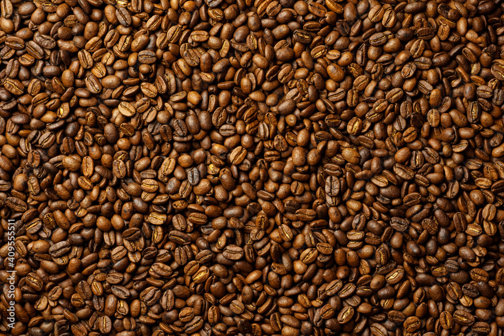 Obraz premium top view of fresh roasted coffee beans background