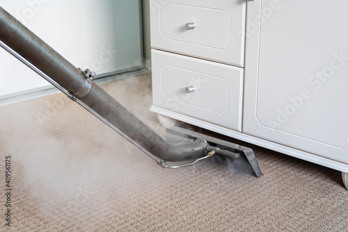 Steam Carpet Cleaning Of Carpets In A Bedroom - professional carpet cleaning