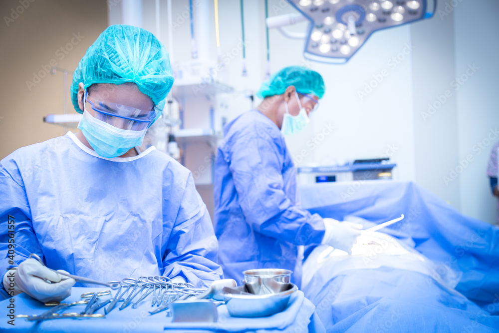 Team of surgeon in uniform perform operation on a patient at cardiac surgery clinic. Team of surgeon in uniform perform operation on a patient at cardiac surgery clinic.