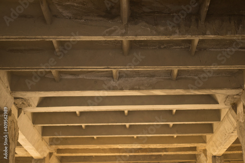 Ceiling beams in a building under construction. photo