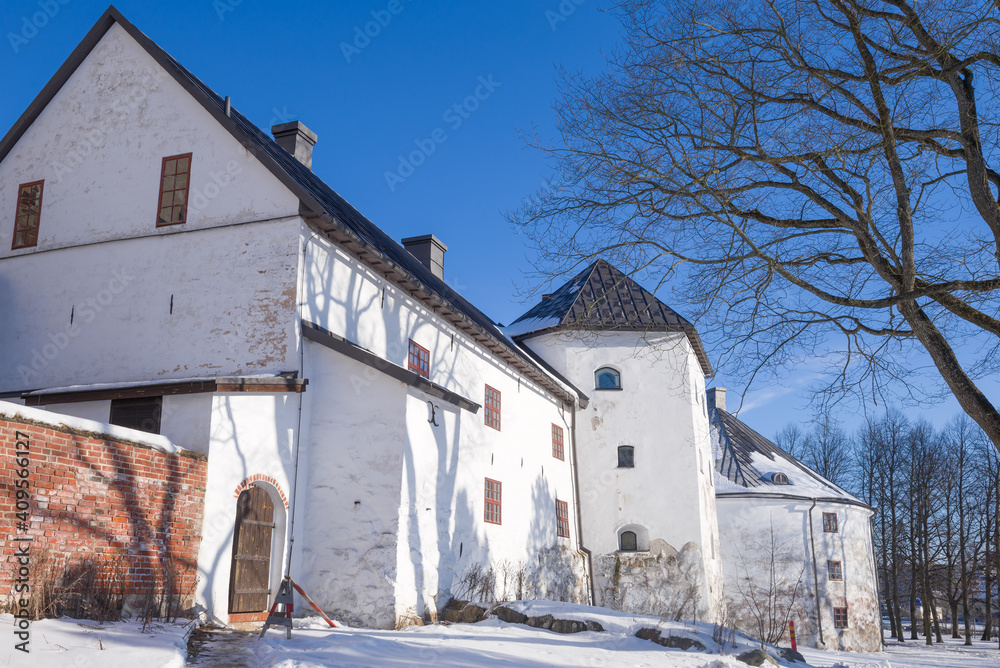 At the walls of the medieval bishop's castle of Abo on a sunny February day. Turku, Finland At the walls of the medieval bishop's castle of Abo on a sunny February day. Turku, Finland