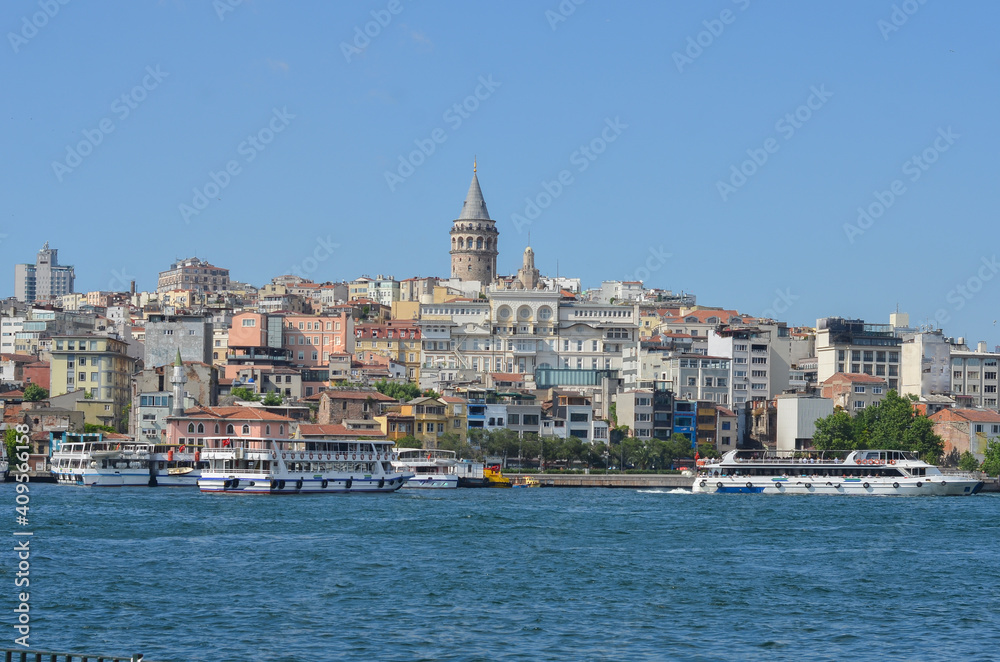 Istanbul cityscape with Galata Tower and passenger boats - Istanbul, Turkey
