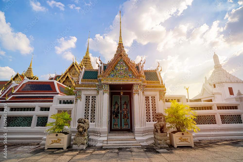 Typical ancient Thai architecture. View of the main building of Wat Phra Kaew - The Grand Royal Palace complex. Typical ancient Thai architecture. View of the main building of Wat Phra Kaew - The Grand Royal Palace complex.