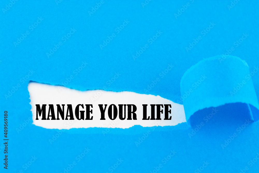 The text MANAGE YOUR LIFE appearing behind torn white paper The text MANAGE YOUR LIFE appearing behind torn white paper