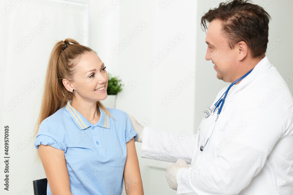 male doctor communicates with patient examination hospital