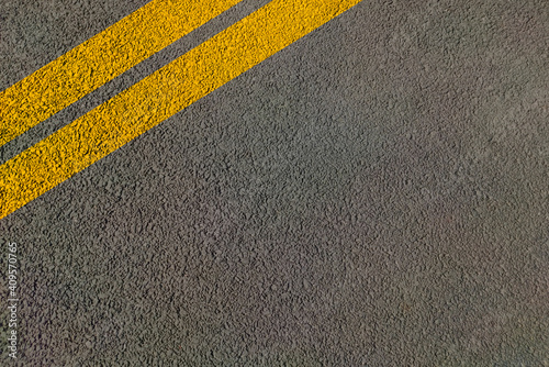 Double yellow lines on road painted for directional movement in lanes without overtaking .
