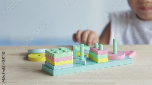 boy playing children toys for learning for skills