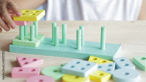 boy playing children toys for learning for skills