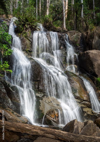 waterfall cascading over rocks © David