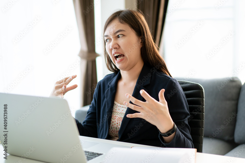 Crazy Asian businesswoman working at the office with suffer and unhappy emotion. Crazy Asian businesswoman working at the office with suffer and unhappy emotion.