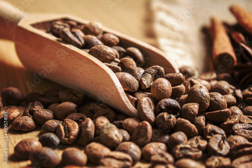 Anise stars and cinnamon on roasted coffee beans.selectiv focus photo