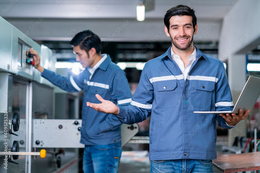 Supervisor manager male engineer worker wears uniform working hand use laptop stock checking in store warehouse shipping industrial. team with safety uniform checking quantity of product on shelf Supervisor manager male engineer worker wears uniform working hand use laptop stock checking in store warehouse shipping industrial. team with safety uniform checking quantity of product on shelf