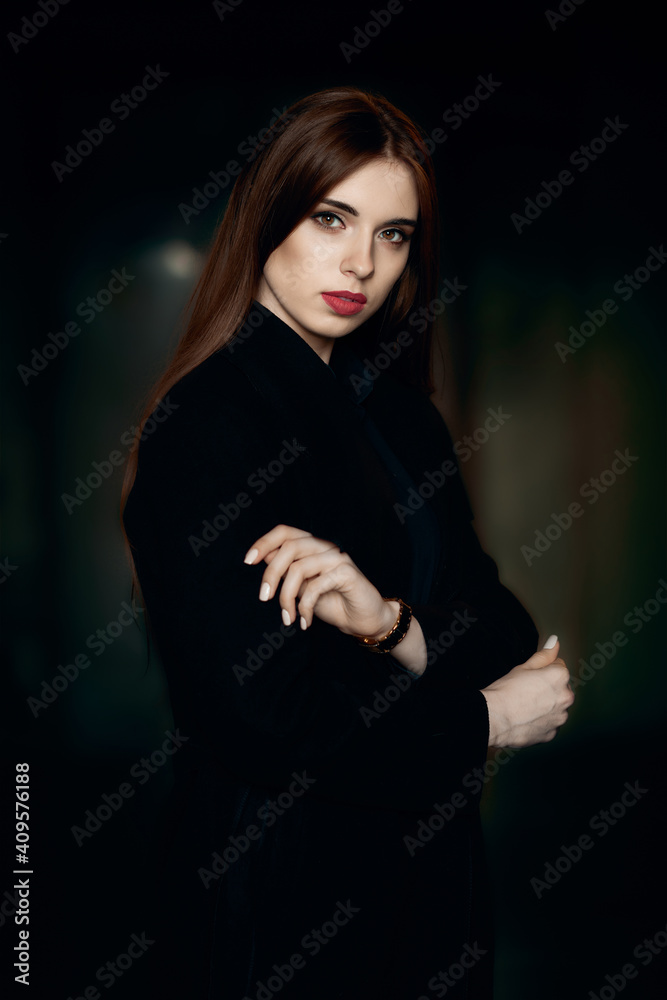 Low key portrait of beautiful girl with natural make up and red lips Low key portrait of beautiful girl with natural make up and red lips