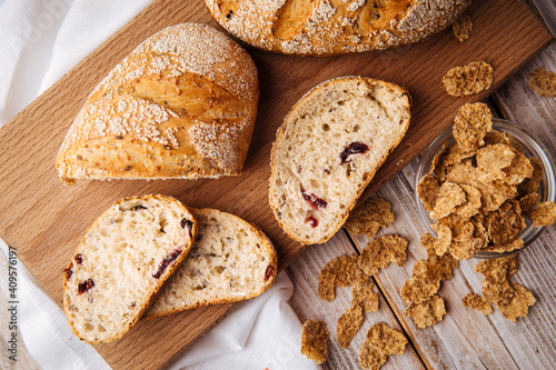 Top view on sliced muesli cereal bread on the wooden cutting board