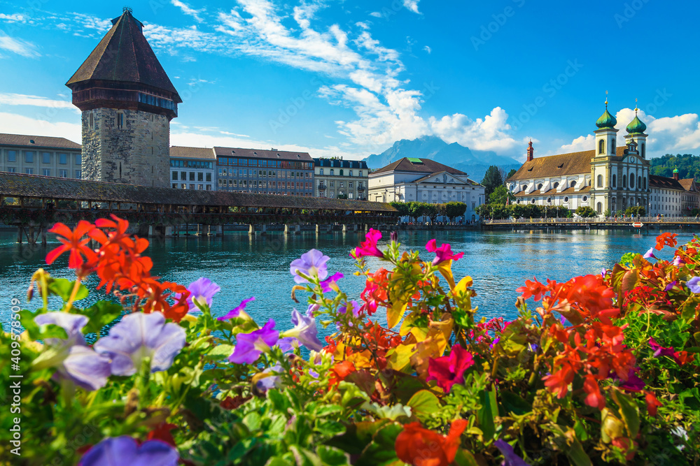 Flowery waterfront and Chapel bridge on the Reuss river, Lucerne